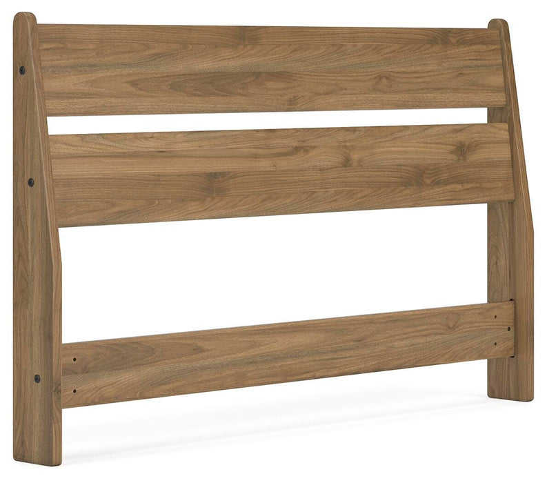 Ashley Furniture Deanlow Bed with a modern wooden frame and angled design, shown in a stylish bedroom setting.