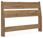 Ashley Furniture Deanlow Bed with a modern wooden frame and angled design, shown in a stylish bedroom setting.