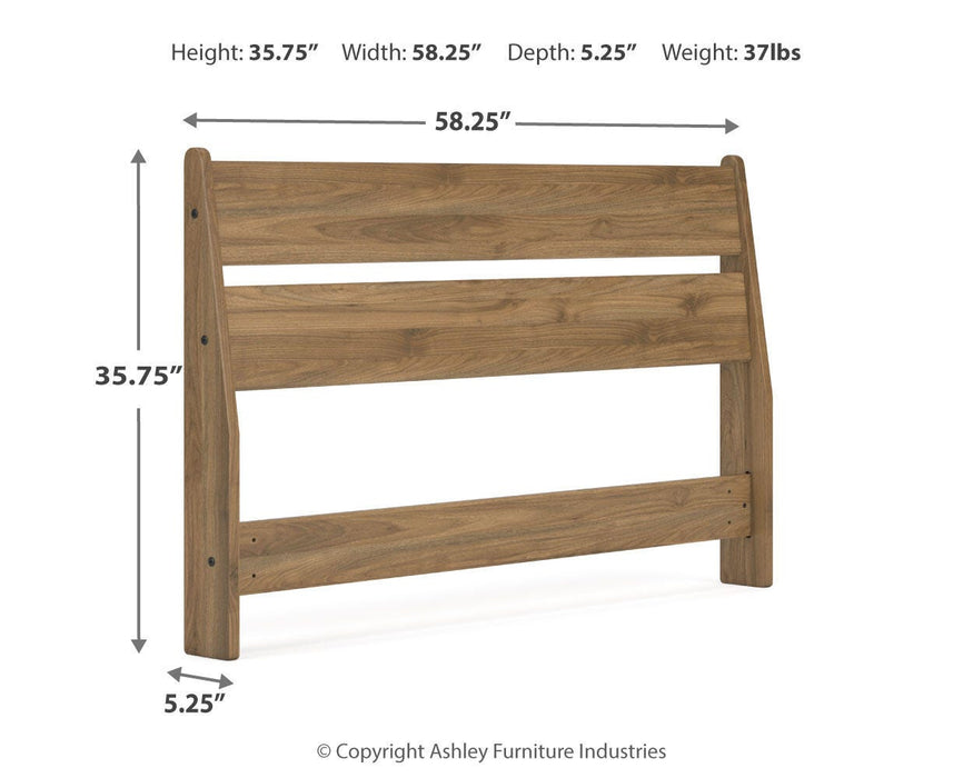 Ashley Furniture Deanlow bed with a wooden frame and headboard, featuring a classic design perfect for a cozy bedroom setting.