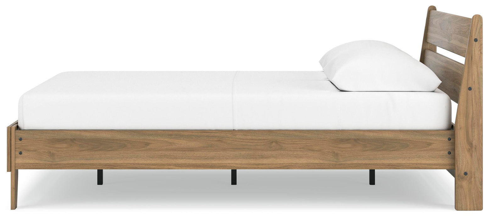 Ashley Furniture Deanlow Bed shown from a side angle, featuring a modern wooden frame with clean lines and a warm finish.