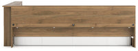 Ashley Furniture Deanlow Bed with sleek wooden frame and beige upholstery, shown from a side angle in a modern bedroom setting.