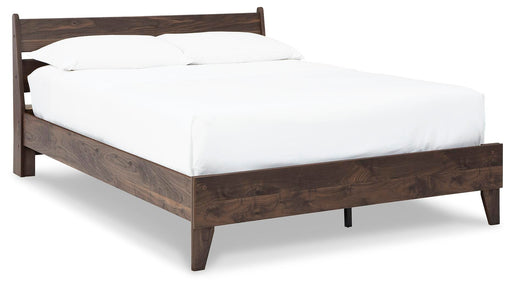 Ashley Furniture Calverson Bed with a stylish wooden frame and angled side view, showcasing its elegant design.