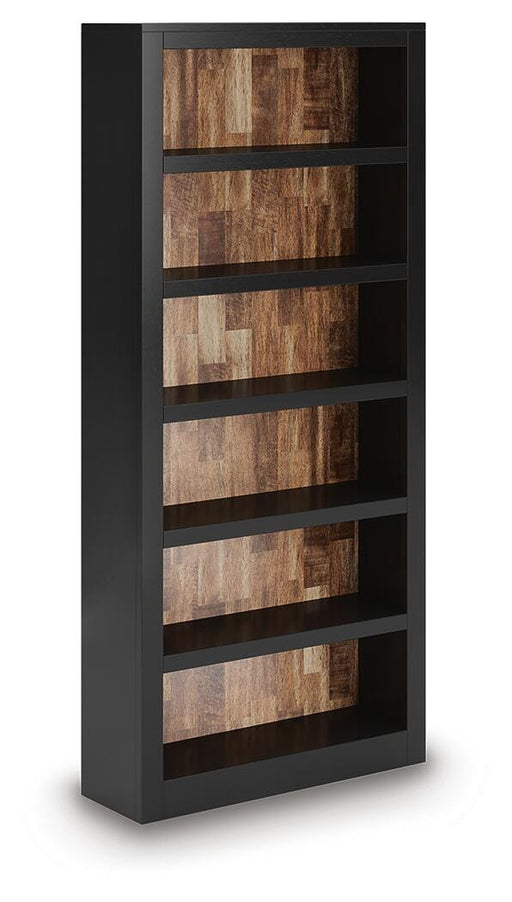 Wildenauer 75-inch wooden bookcase by Ashley Furniture with open shelves and a dark finish, shown from an angled side view.