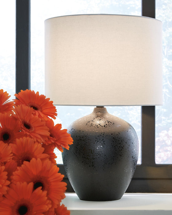 Ashley Furniture Ladstow Table Lamp Set featuring two stylish lamps with fabric shades and wooden bases for elegant lighting.