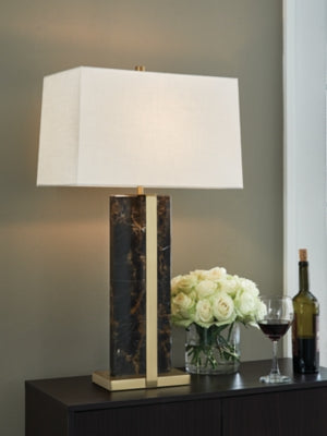 Ashley Furniture Neonish table lamp with a sleek design and illuminated base, perfect for modern home decor.