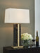 Ashley Furniture Neonish table lamp with a sleek design and illuminated base, perfect for modern home decor.