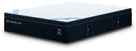 Side view of a DreamCloud Hybrid Premier 4.0 mattress showing its plush, layered design with a soft, quilted surface.
