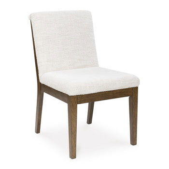Ashley Furniture Marxmore dining chair with upholstered seat and wooden legs, angled view showing modern design and comfortable seating.