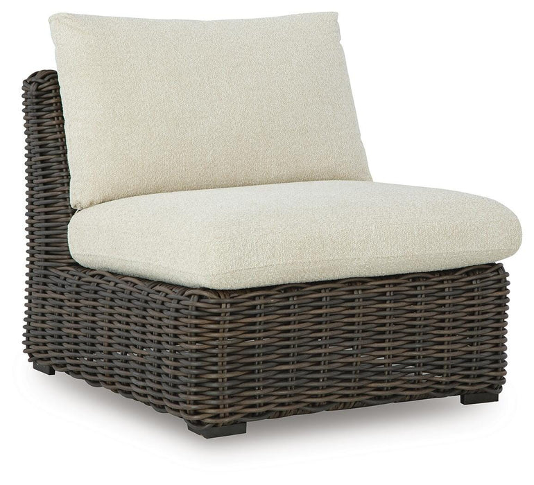 Ashley Furniture Kimora outdoor sectional with beige cushions and dark metal frame, arranged for relaxing outdoor seating.