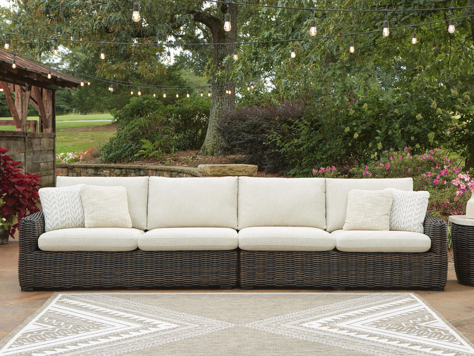 Outdoor sectional by Ashley Furniture, Kimora Outdoor Seating with plush cushions and stylish design, perfect for patio relaxation.