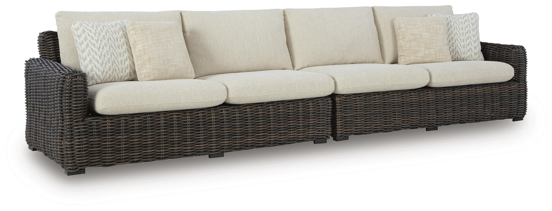 Ashley Furniture Kimora outdoor sectional with cushioned seating and weather-resistant wicker, shown from an angled view.