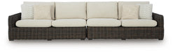 Ashley Furniture Kimora outdoor sectional with beige cushions and stylish woven rattan frame, perfect for patio seating.