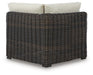 Ashley Furniture Kimora outdoor sectional with cushioned seating and modern design, shown from the back in a stylish outdoor setting.