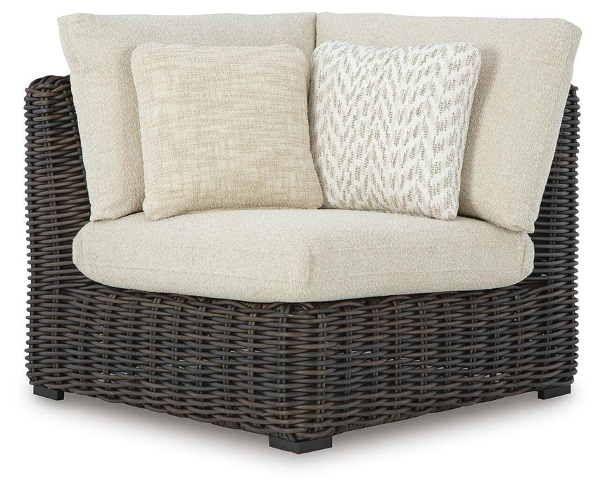 Ashley Furniture Kimora outdoor sectional with plush cushions and modern design, perfect for outdoor seating on a patio or garden.