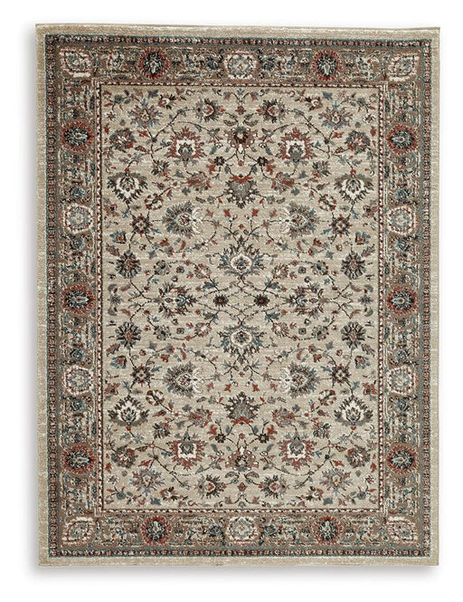 Ashley Furniture Beritham Rug with intricate patterns in neutral tones, showcasing a plush, woven texture.