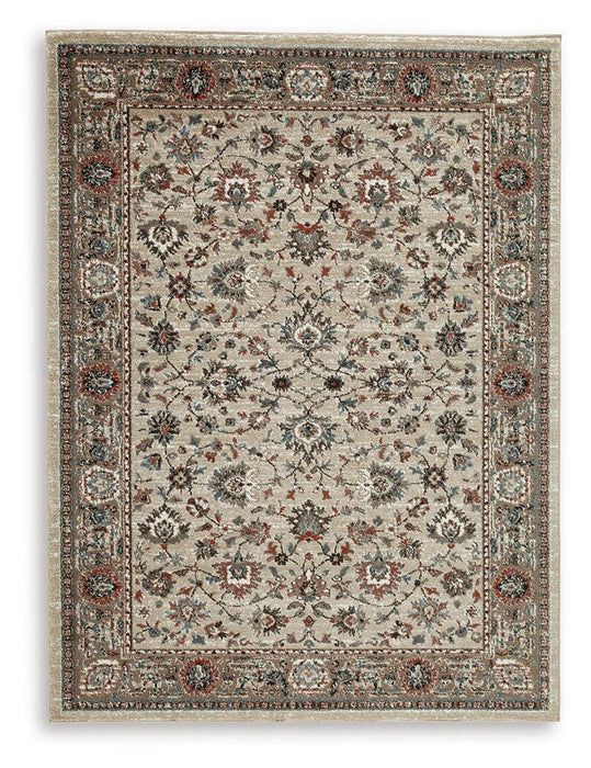 Ashley Furniture Beritham Rug with intricate patterns in neutral tones, showcasing a plush, woven texture.