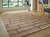 Ashley Furniture Orest Rug with geometric pattern in neutral tones, cropped view showing textured woven design.