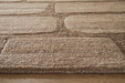 Close-up of Ashley Furniture Orest Rug showcasing intricate woven pattern and soft texture in neutral tones.