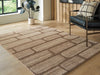 Ashley Furniture Orest Rug with a textured design in neutral tones, shown in a close-up cropped image.