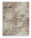 Ashley Furniture Jadenburg Rug with intricate pattern and soft texture, perfect for enhancing living room decor.