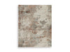 Ashley Furniture Jadenburg Rug with intricate patterns and neutral tones, perfect for adding style to living spaces.
