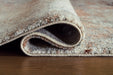 Close-up of Ashley Furniture Jadenburg Rug with detailed woven pattern and neutral tones, showcasing the textured surface.