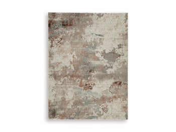 Ashley Furniture Jadenburg Rug featuring a stylish pattern and soft texture, perfect for adding warmth to any room.