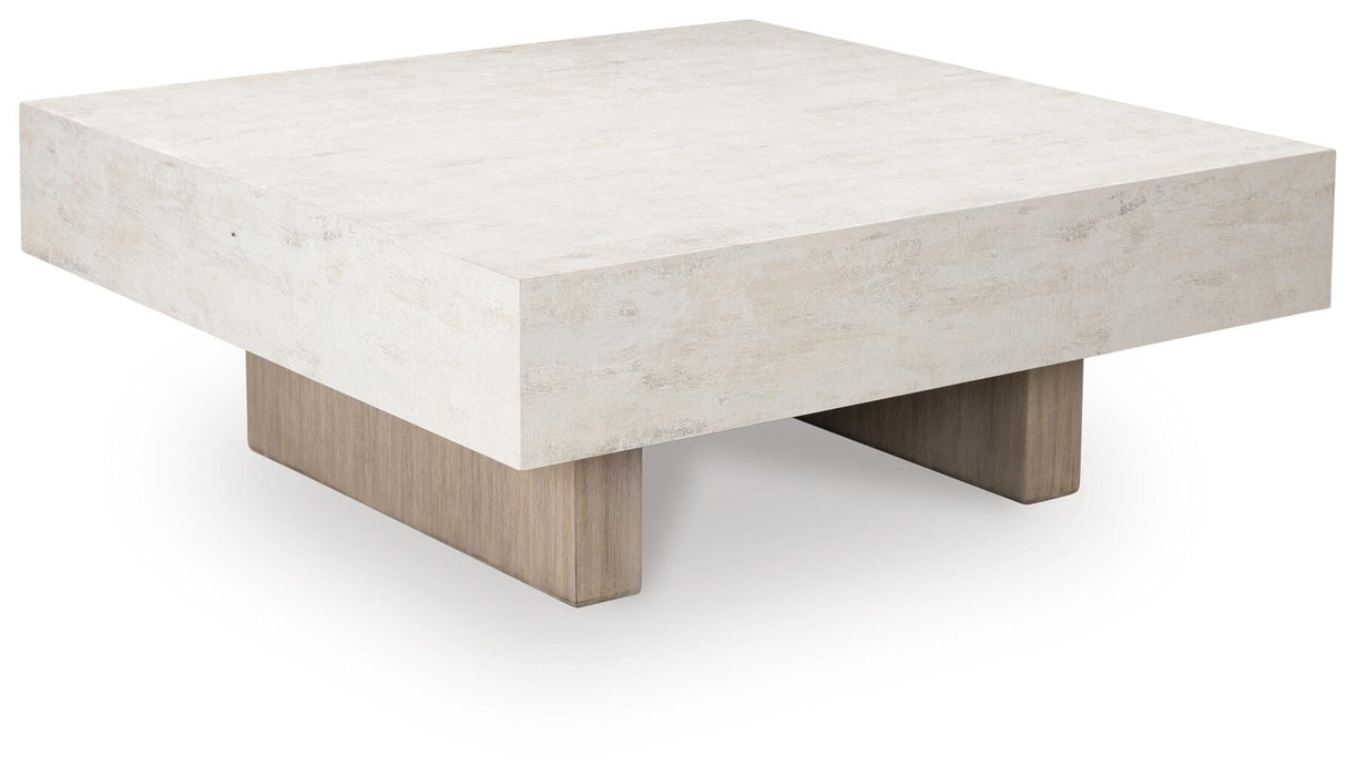 Ashley Furniture Jorlaina Coffee Table, modern cocktail table with a sleek wood finish and angled design, shown from a side angle.
