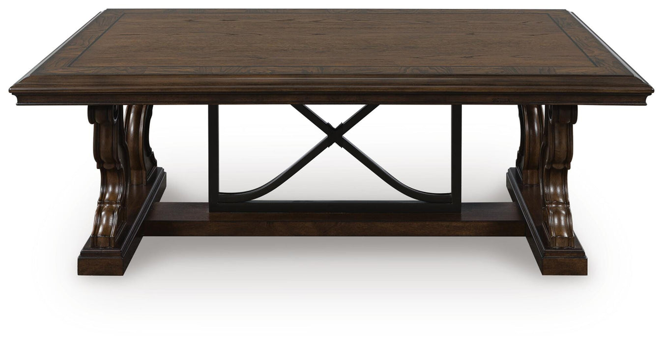 Ashley Furniture Maylee coffee table, modern cocktail table with sleek wood finish, front view showing clean design and sturdy legs.