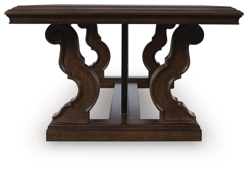 Ashley Furniture Maylee coffee table with a sleek wooden top and modern design, shown from a side view.