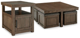 Ashley Furniture Boardernest occasional table set featuring three wooden tables with sleek, modern design and warm wood finishes.