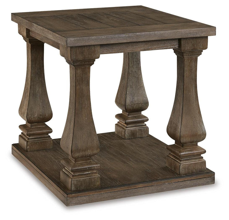 Ashley Furniture Johnelle end table with a dark wood finish and sleek design, shown from an angled side view.