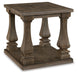 Ashley Furniture Johnelle end table with a dark wood finish and sleek design, shown from an angled side view.