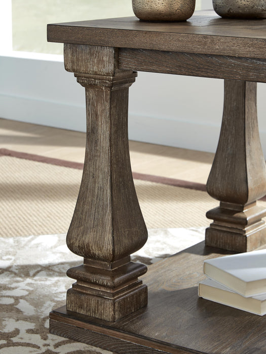 Ashley Furniture Johnelle end table with a sleek wooden top and metal legs, modern living room accent piece.