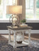 Ashley Furniture Havalance end table with a sleek wooden top and modern metal legs, shown in a close-up view.