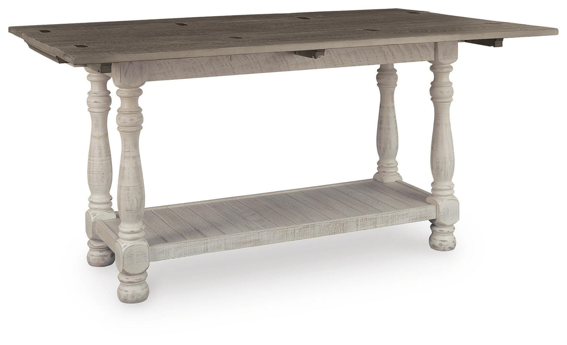 Ashley Furniture Havalance sofa console table with open storage and angled design, shown from a side view.