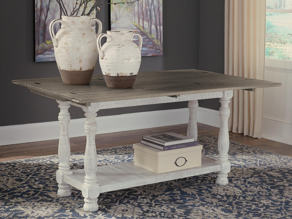 Ashley Furniture Havalance sofa table with open shelves and modern design, showcasing a sleek wooden finish and contemporary style.