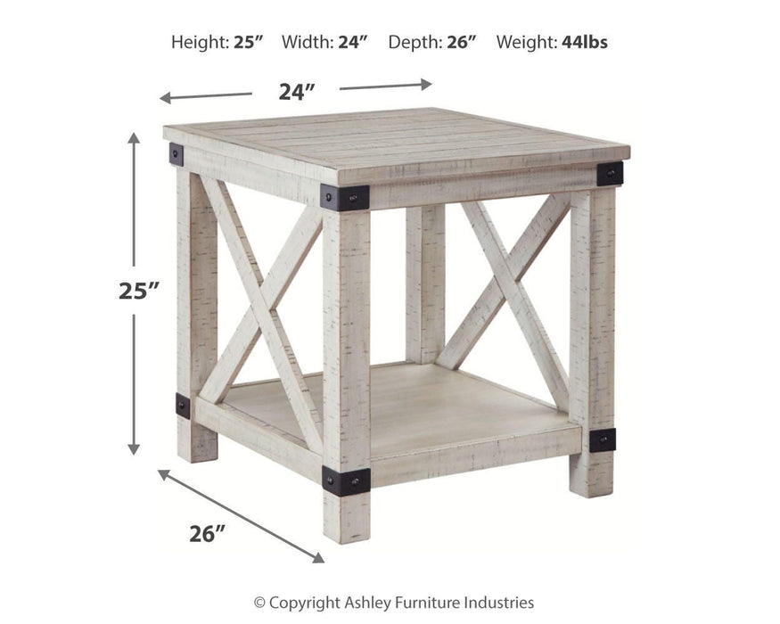 Ashley Furniture Carynhurst end table with a wooden top and tapered legs, showcasing a classic and elegant design.