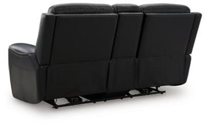 Ashley Furniture 5Z-Relaxation power reclining loveseat with console, showing plush backrest and armrests in a cozy living room setting.