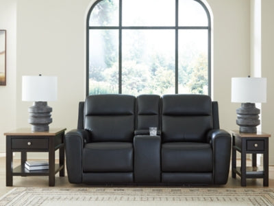 Ashley Furniture 5Z-Relaxation Power Reclining Loveseat with Console, showing plush upholstery and built-in cupholders in a cozy living room setting.