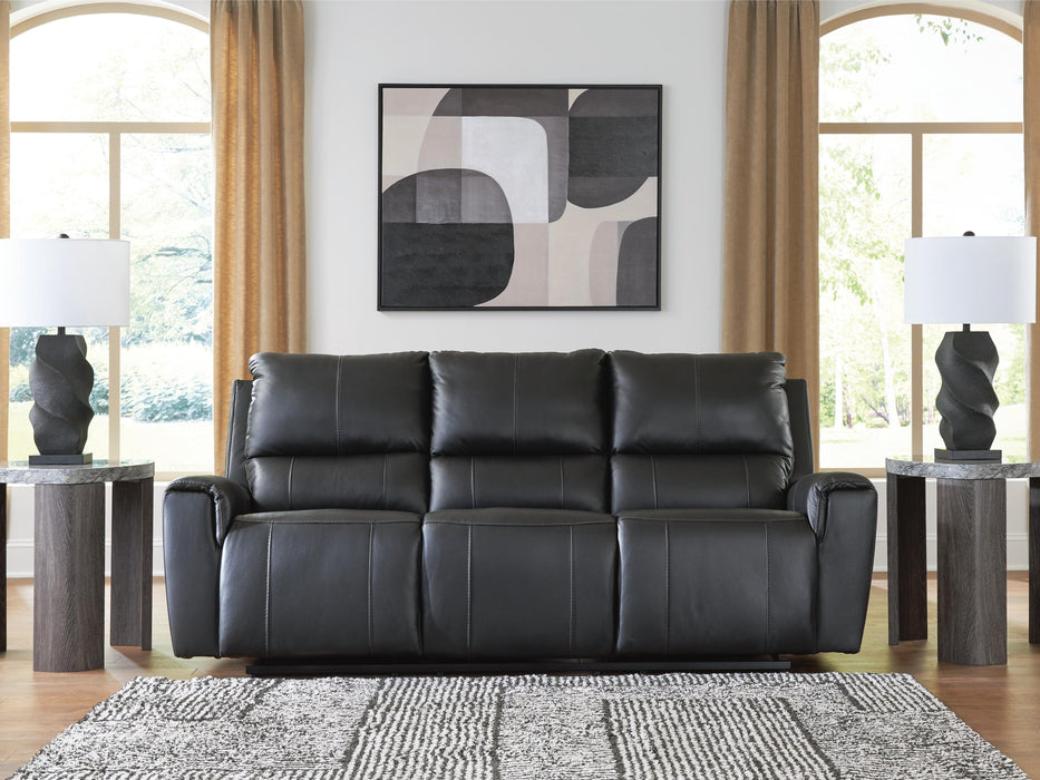Ashley Furniture Glossmore reclining living room set with plush cushions and a modern design, shown in a cozy home setting.