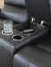 Ashley Furniture Glossmore reclining living room set with console, featuring plush upholstery and modern design details.