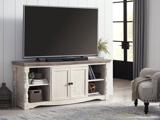 Ashley Furniture Havalance 67-inch TV stand with open shelves and storage cabinets, dark wood finish, modern design.