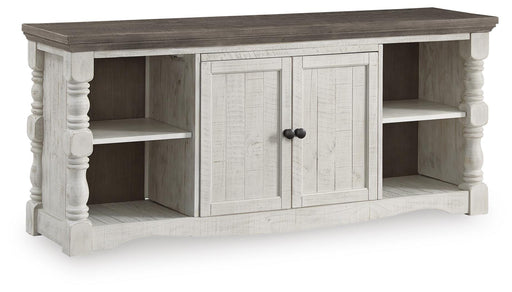 Ashley Furniture Havalance 67-inch TV stand with open shelves and closed cabinets, shown from an angled view.